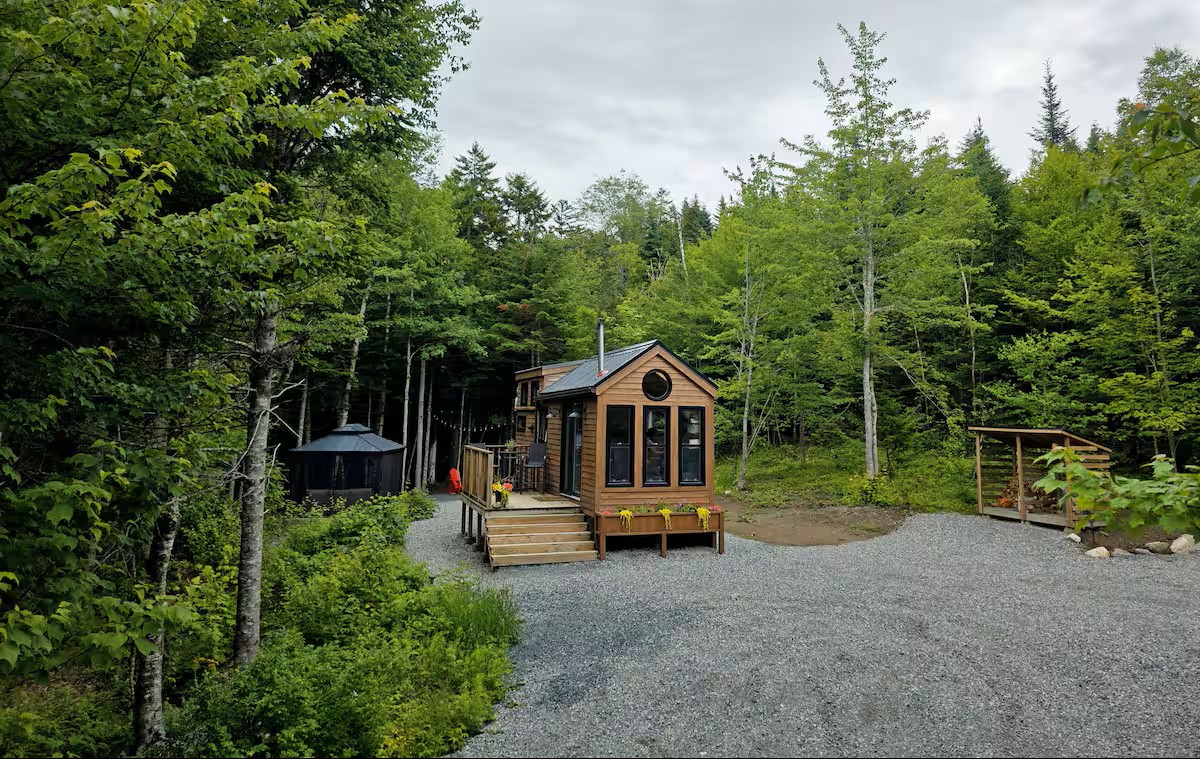 Tiny house exterior in the forest clearing